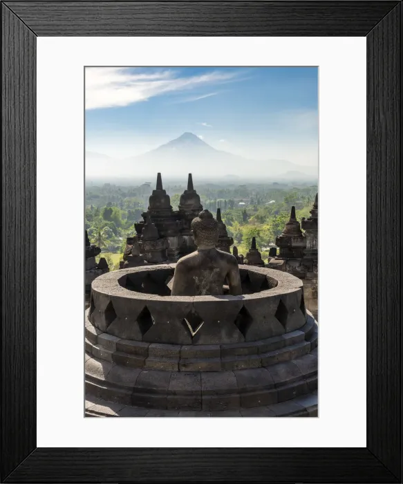 Framed Print : Buddha statue with Mount Merapi in the background, Candi Borobudur buddhist temple Framed Print : Buddha statue with Mount Merapi in the background, Candi Borobudur buddhist temple