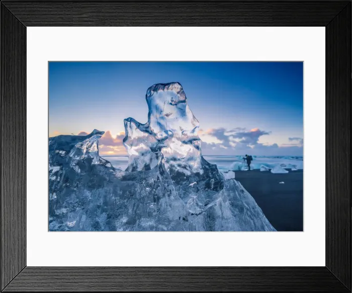 Framed Print : Jokulsarlon, Iceland. A transparent block of ice and a photographer on
