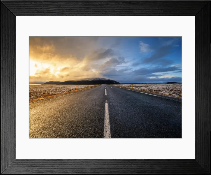 Framed Print : Iceland, Northern Europe. A paved road with dramatic sky Framed Print : Iceland, Northern Europe. A paved road with dramatic sky