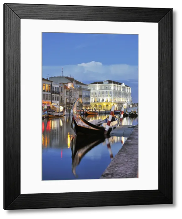 Framed Print : Aveiro at twilight and the traditional boat Moliceiro. Portugal Framed Print : Aveiro at twilight and the traditional boat Moliceiro. Portugal