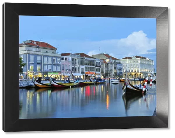 Aveiro at twilight and the traditional boat Moliceiro. Portugal