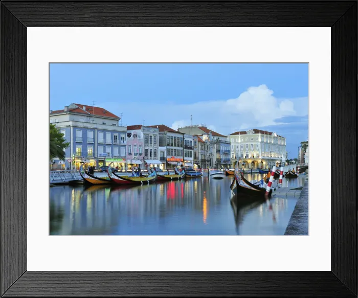 Framed Print : Aveiro at twilight and the traditional boat Moliceiro. Portugal Framed Print : Aveiro at twilight and the traditional boat Moliceiro. Portugal