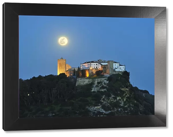 The medieval castle of Palmela in a full moon night. Portugal