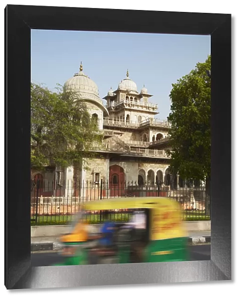 Autorickshaw passing Albert Hall, Jaipur, Rajasthan, India