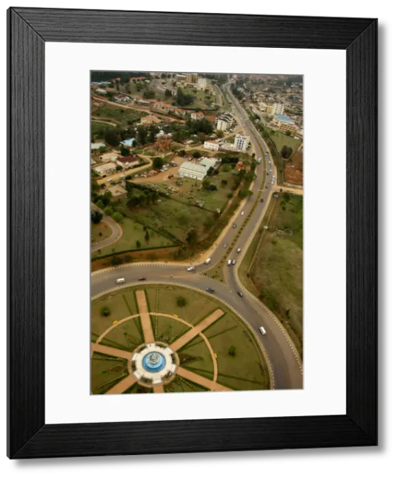 Framed Print : Kigali, Rwanda. A carefully modelled roundabout marks the beginning of the airport road Framed Print : Kigali, Rwanda. A carefully modelled roundabout marks the beginning of the airport road