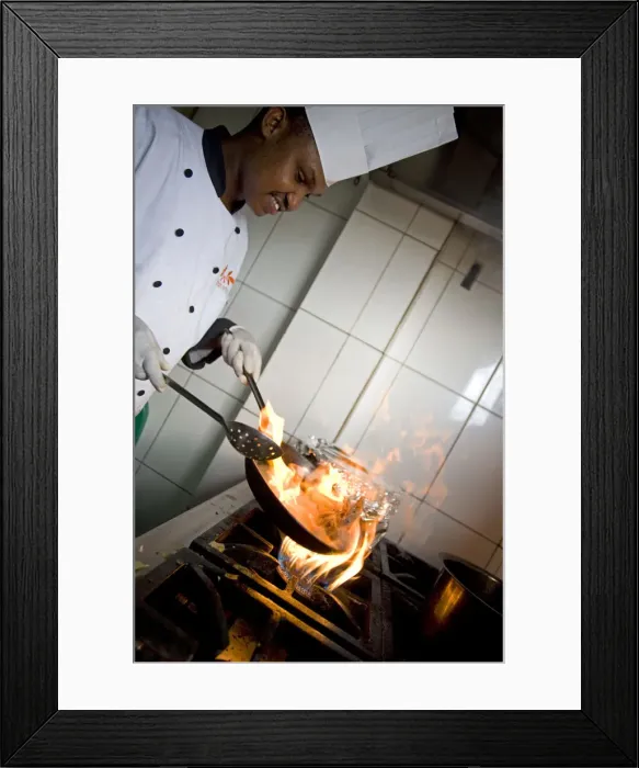 Framed Print : Kigali, Rwanda. A chef prepares lunch at the Bourbon Coffee shop. (MR) Framed Print : Kigali, Rwanda. A chef prepares lunch at the Bourbon Coffee shop. (MR)