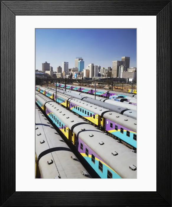 Framed Print : Train carriages at Park Station with city skyline in background, Johannesburg, Gauteng Framed Print : Train carriages at Park Station with city skyline in background, Johannesburg, Gauteng