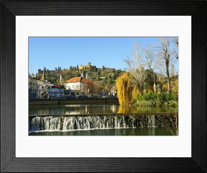 Framed Print : A willow tree over the Nabao river and the Templar castle on the top of the hill. Tomar Framed Print : A willow tree over the Nabao river and the Templar castle on the top of the hill. Tomar