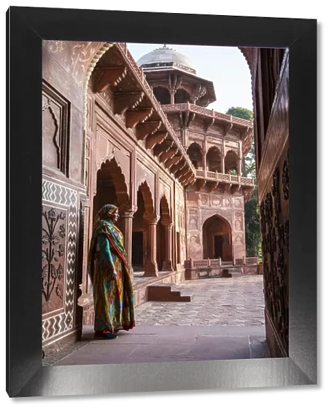 India, Uttar Pradesh, Agra, a loacl woman dressed in a saree standing in the doorway