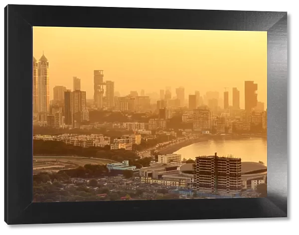 India, Maharashtra, Mumbai, sunset over the city centre and Haji Ali Bay showing the