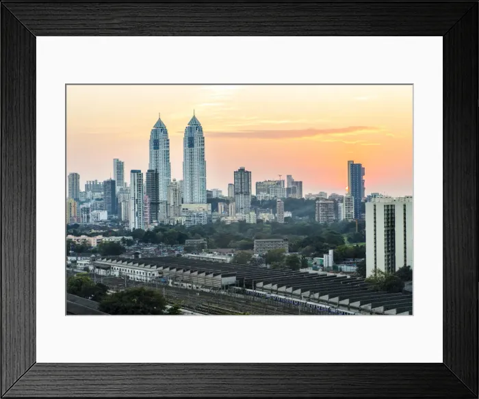 Framed Print : India, Maharashtra, Mumbai, sunset over the city centre and railway sheds outside Framed Print : India, Maharashtra, Mumbai, sunset over the city centre and railway sheds outside
