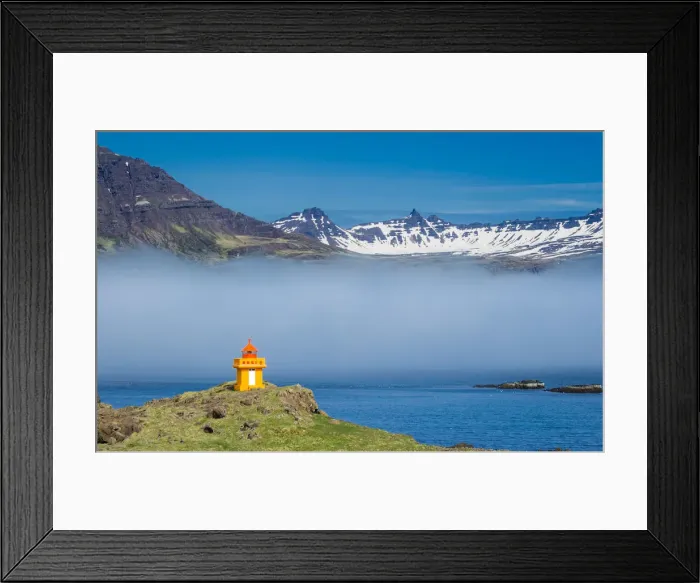 Framed Print : Lighthouse on cliff at Djupivogur against mountain range, East Iceland, Iceland Framed Print : Lighthouse on cliff at Djupivogur against mountain range, East Iceland, Iceland