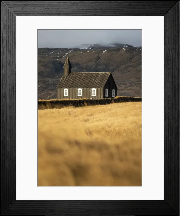 Framed Print : Buoakirkja Black Church on field against mountain in Budir, Snaefellsness Peninsula Framed Print : Buoakirkja Black Church on field against mountain in Budir, Snaefellsness Peninsula
