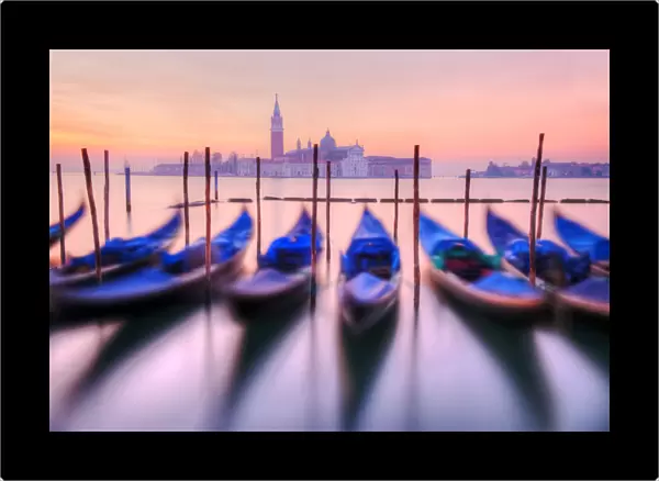 Moored gondolas with San Giorgio Maggiore in the background at dawn, Venice, Veneto