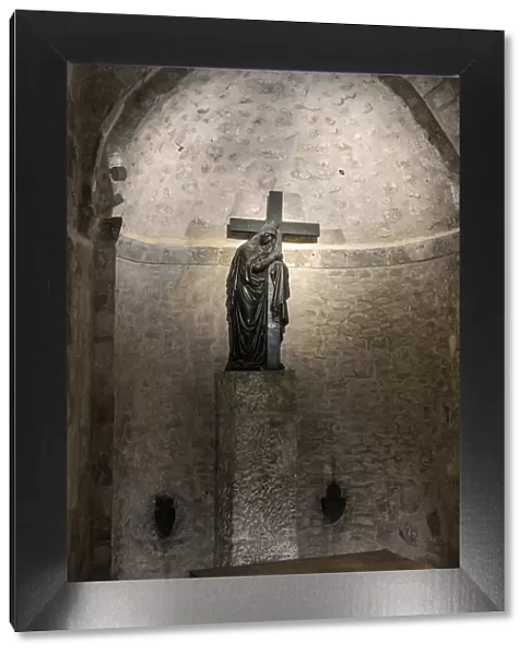 Israel, Jerusalem District, Jerusalem. Cross inside the grottos beneath the Church