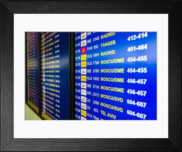 Framed Print : Departure board monitor at Barcelona El Prat international airport, Barcelona, Catalonia
