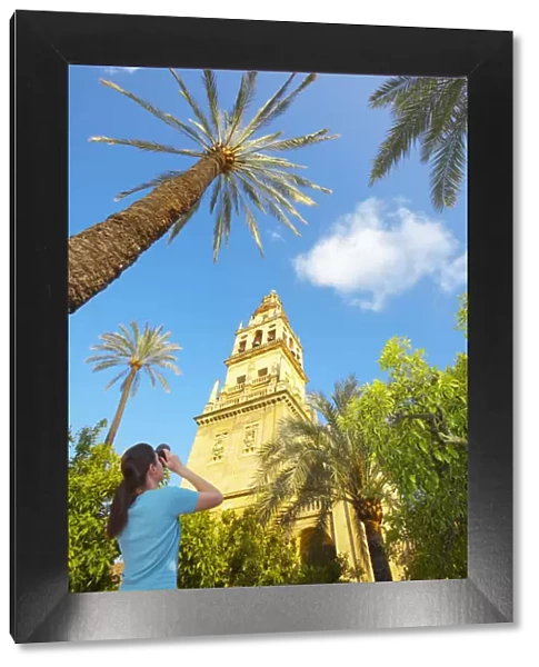 Spain, Andalucia, Cordoba, woman photographing La Mezquita cathedral, Low view (MR)