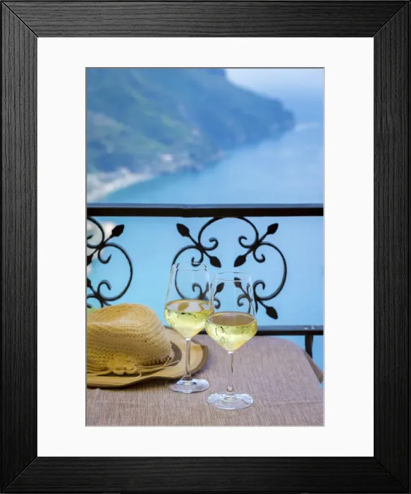 Framed Print : Amalfi Coast, Italy, a table for two, a summer hat and two glasses of white wine with Framed Print : Amalfi Coast, Italy, a table for two, a summer hat and two glasses of white wine with