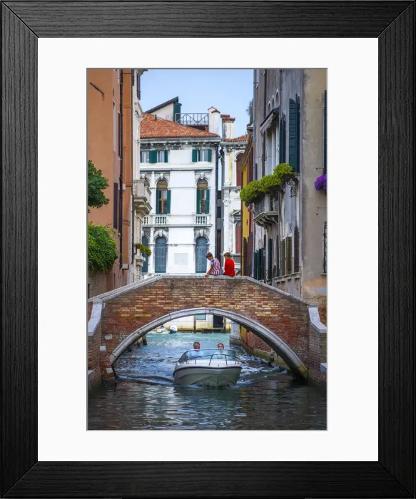 Framed Print : Venice, Veneto, Italy. Two boys sitting on a canals bridge