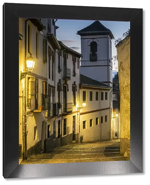Picturesque view at dusk of a street in the Albayzin district, Granada, Andalusia, Spain