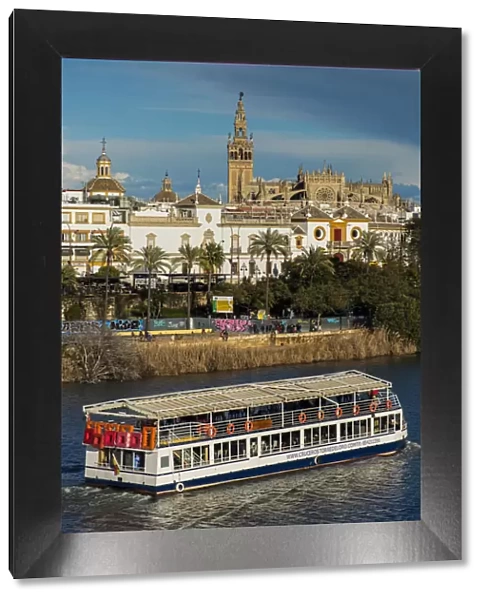 River Guadalquivir with Cathedral and Giralda bell tower in the background, Seville