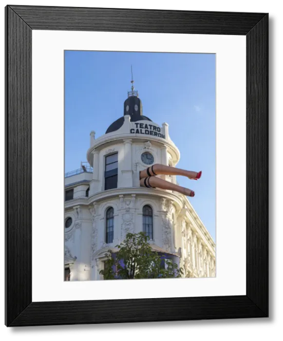 Framed Print : Teatro Calderon, Calderon theatre with giant model legs sticking out of window, Madrid
