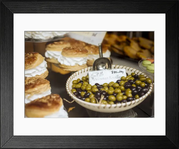 Framed Print : Cakes and Olives on display in shop window, Seville, Andalucia, Spain Framed Print : Cakes and Olives on display in shop window, Seville, Andalucia, Spain
