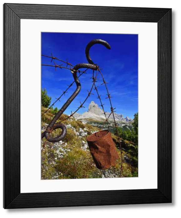 Framed Print : Barbed wire with old tin cans with bullet holes, 1st World War Freilichtmusem, Monte Framed Print : Barbed wire with old tin cans with bullet holes, 1st World War Freilichtmusem, Monte