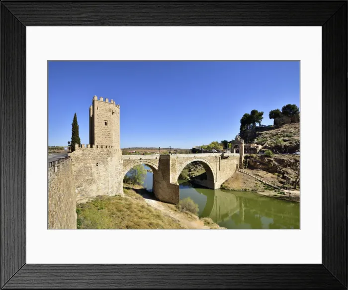 Framed Print : The Puente de Alcantara (Alcantara bridge) over the Tagus river, a roman bridge that Framed Print : The Puente de Alcantara (Alcantara bridge) over the Tagus river, a roman bridge that