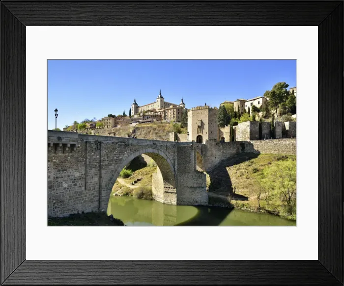 Framed Print : The Puente de Alcantara (Alcantara bridge) over the Tagus river, a roman bridge that Framed Print : The Puente de Alcantara (Alcantara bridge) over the Tagus river, a roman bridge that