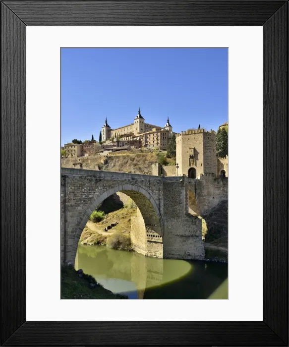 Framed Print : The Puente de Alcantara (Alcantara bridge) over the Tagus river, a roman bridge that Framed Print : The Puente de Alcantara (Alcantara bridge) over the Tagus river, a roman bridge that