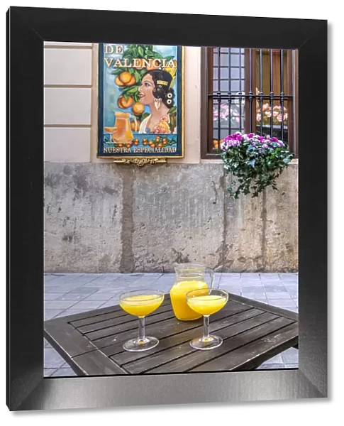 Glasses of Aigua de Valencia cocktail served in an outdoor bar of Valencia, Comunidad