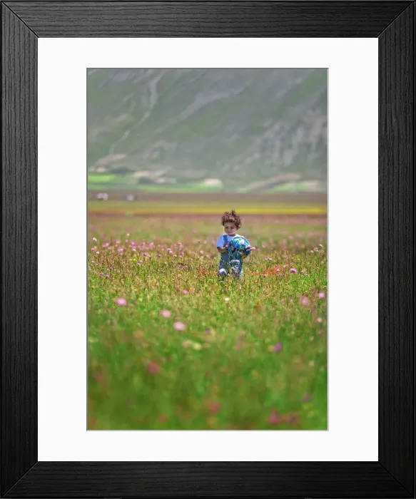 Framed Print : Italy, Umbria, Perugia district, Monti Sibillini NP, Norcia, Pian Grande, baby plays Framed Print : Italy, Umbria, Perugia district, Monti Sibillini NP, Norcia, Pian Grande, baby plays