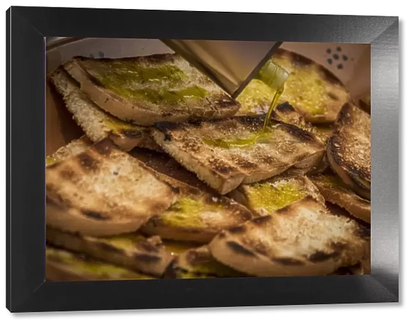 europe, italy, umbria. toasted bread with olive oil