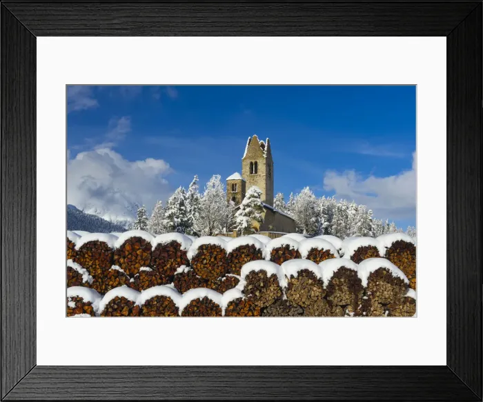 Framed Print : Trunks and old church in Celerina with pristine snow. Engadine, Switzerland, Europe Framed Print : Trunks and old church in Celerina with pristine snow. Engadine, Switzerland, Europe