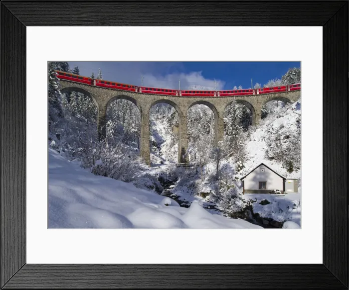 Framed Print : Iconic swiss red Bernina Express train in winter landscape and pristine snow. Swizerland Framed Print : Iconic swiss red Bernina Express train in winter landscape and pristine snow. Swizerland