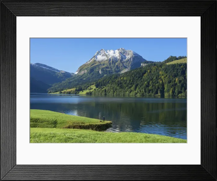 Framed Print : Fisherman at Lake Wagital with Fluebrig mountain in the Glarner Alps at fall Framed Print : Fisherman at Lake Wagital with Fluebrig mountain in the Glarner Alps at fall