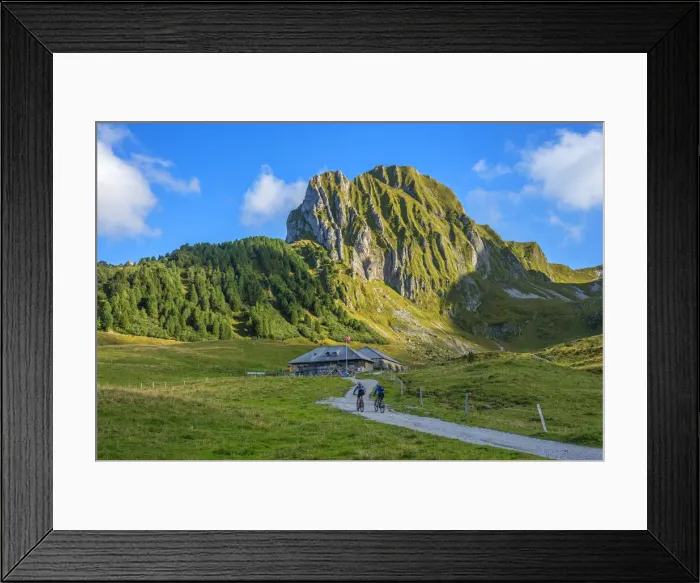 Framed Print : Mountain biker in front of Gantrisch hut and Nünenflue, Berner Alps, Bern Framed Print : Mountain biker in front of Gantrisch hut and Nünenflue, Berner Alps, Bern
