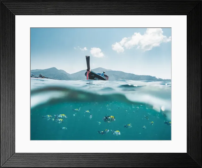 Framed Print : Ko Lipe, Satun Province, Thailand. Split image of long tail boat and colorful fishes
