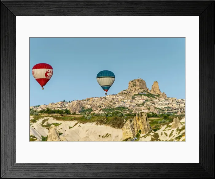 Framed Print : Hot air balloons at sunrise with mountain village of Ortahisar in the background Framed Print : Hot air balloons at sunrise with mountain village of Ortahisar in the background