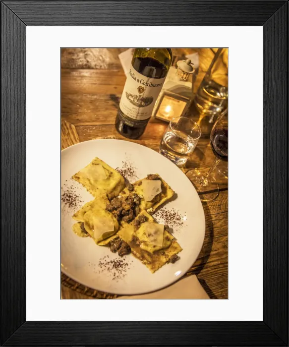 Framed Print : Italy, Tuscany, candle light dinner with ravioli and chianti wine in Suvereto