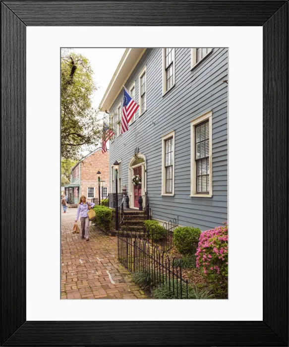 Framed Print : USA, Georgia, Savannah Woman walking past a typical house Framed Print : USA, Georgia, Savannah Woman walking past a typical house