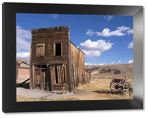 Abandoned wooden house and wagon in Bodie ghost Town, California, USA
