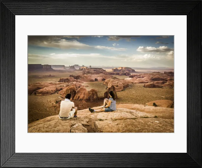 Framed Print : Utah - Ariziona border, two young tourists watching the panorama of the Monument Valley Framed Print : Utah - Ariziona border, two young tourists watching the panorama of the Monument Valley