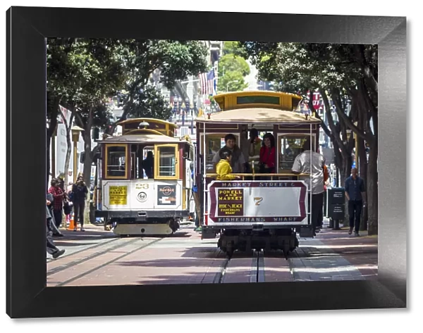 San Francisco, California, USA. Two cable cars in the streets of Frisco, one of the