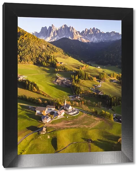 Aerial view of Santa Maddalena town in autumn, Funes valley, Dolomites, Italy