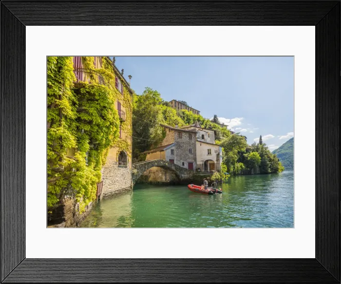 Framed Print : Nesso, lake Como, Como province, Italy. A small boat approaching the roman stone bridge Framed Print : Nesso, lake Como, Como province, Italy. A small boat approaching the roman stone bridge