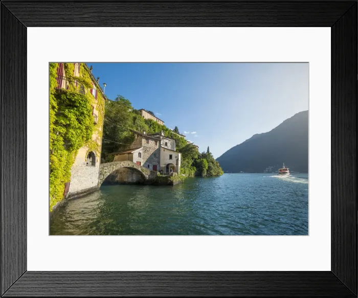 Framed Print : Nesso, lake Como, Como province, Italy. The roman stone bridge and a tourist boat Framed Print : Nesso, lake Como, Como province, Italy. The roman stone bridge and a tourist boat