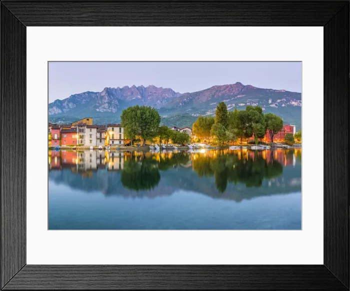 Framed Print : Lecco, Lombardy, Italy. Colorful houses and the Mount Resegone reflected onto Framed Print : Lecco, Lombardy, Italy. Colorful houses and the Mount Resegone reflected onto