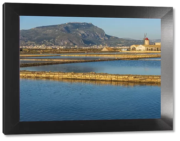 Europe, Italy, Sicily. In the saline of Trapani looking towards Erice